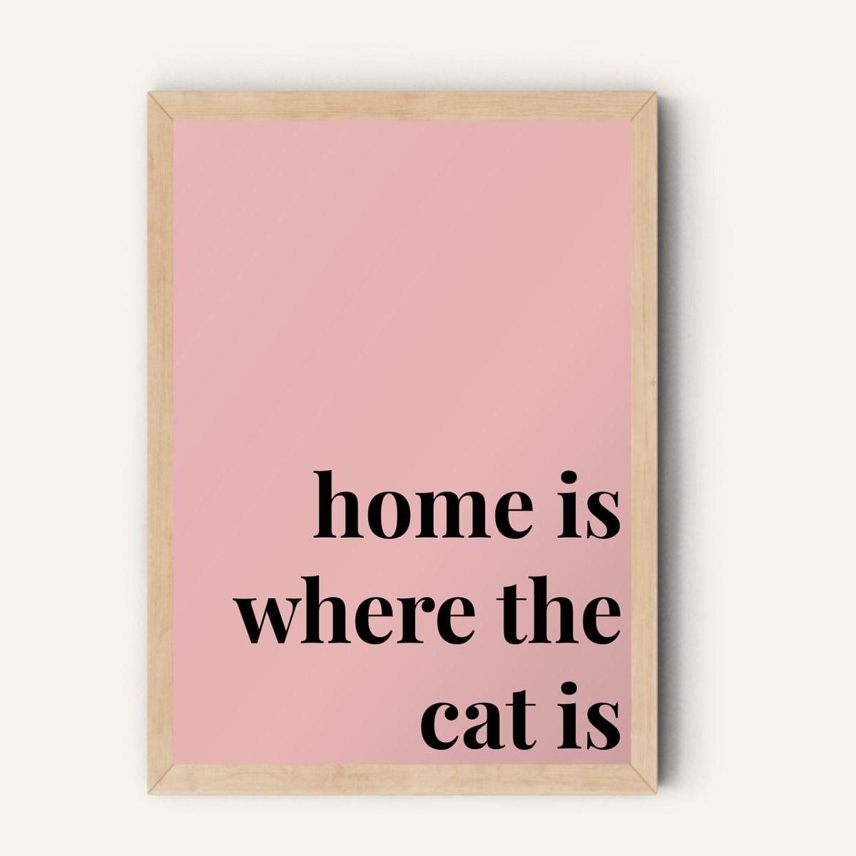 Quote hero: Home Is Where The Cat Is — Blush Pink (#E8B5B5), Natural Wood Frame, A-series