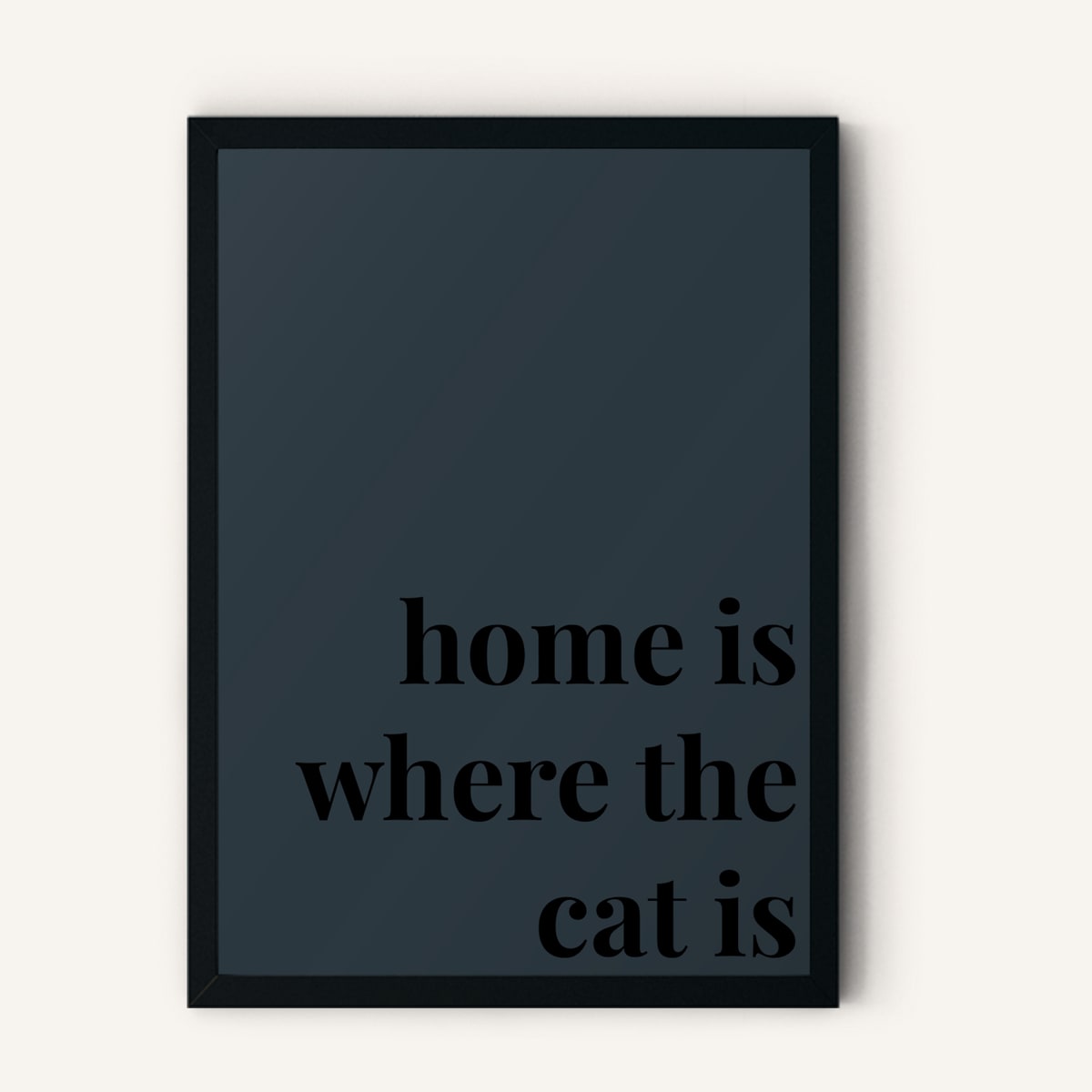 Quote hero: Home Is Where The Cat Is — Navy Grey (#2C3840), Black Frame, A-series