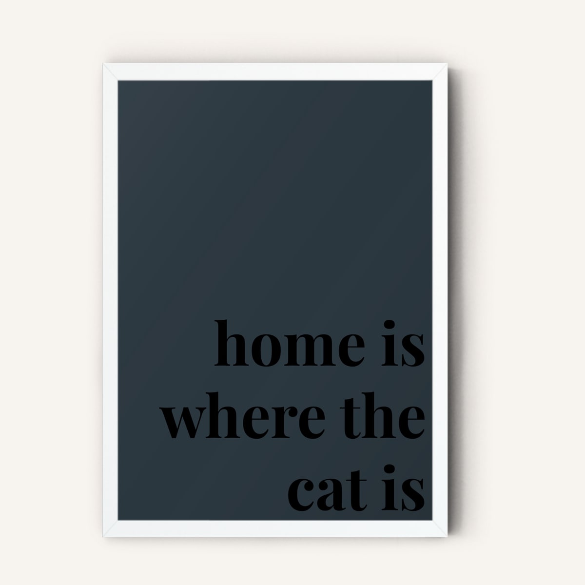 Quote hero: Home Is Where The Cat Is — Navy Grey (#2C3840), White Frame, A-series