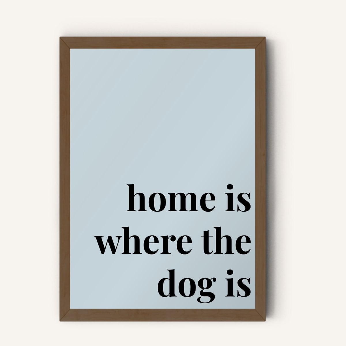 Quote hero: Home Is Where The Dog Is — Duck Egg Blue (#C6D5DB), Dark Wood Frame, A-series