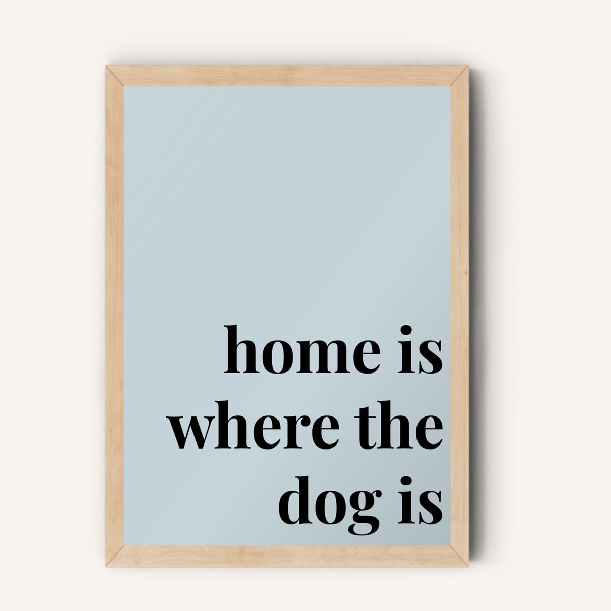 Quote hero: Home Is Where The Dog Is — Duck Egg Blue (#C6D5DB), Natural Wood Frame, A-series