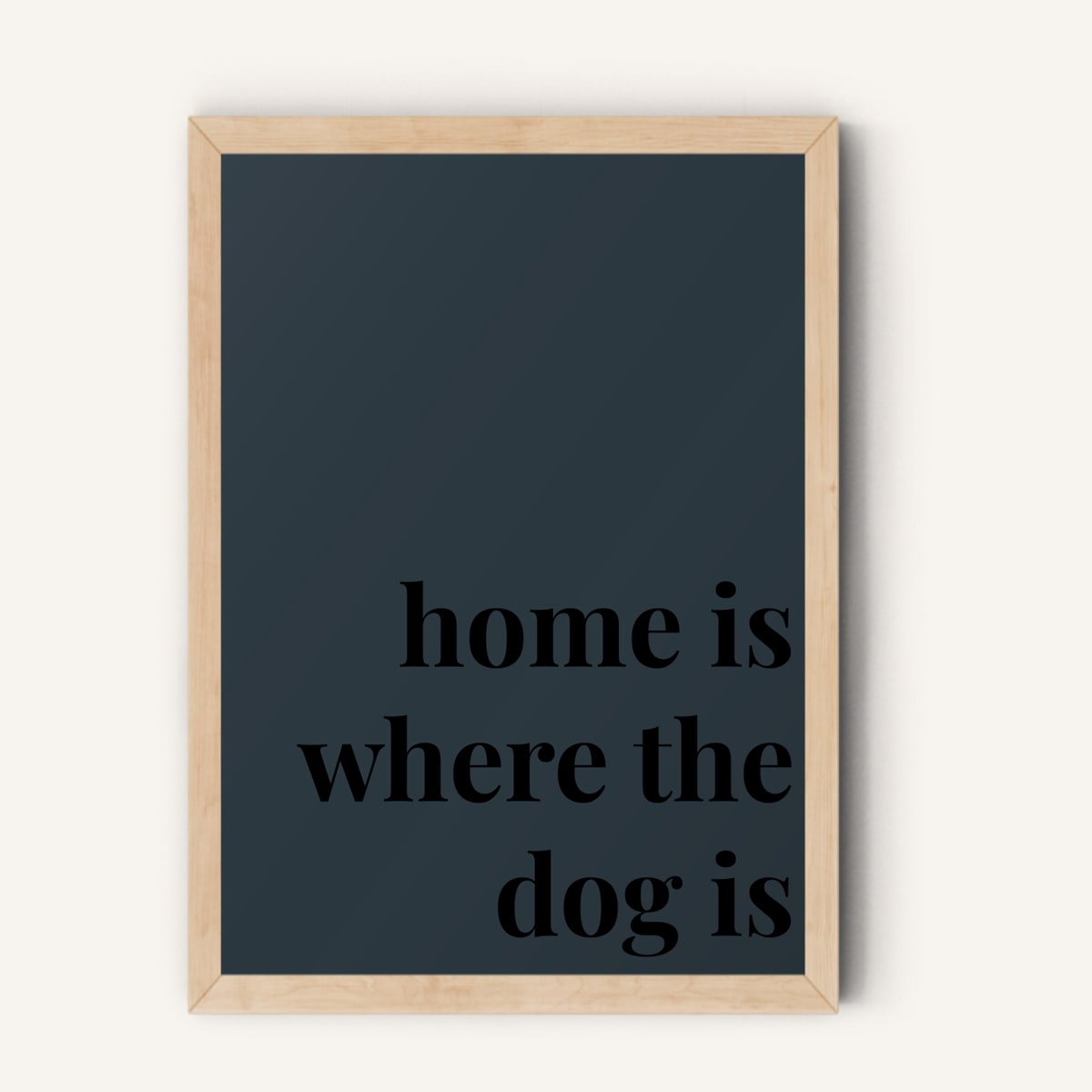 Quote hero: Home Is Where The Dog Is — Navy Grey (#2C3840), Natural Wood Frame, A-series